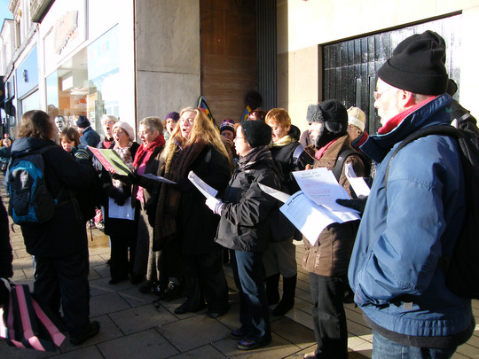Buy Nothing Day street singing