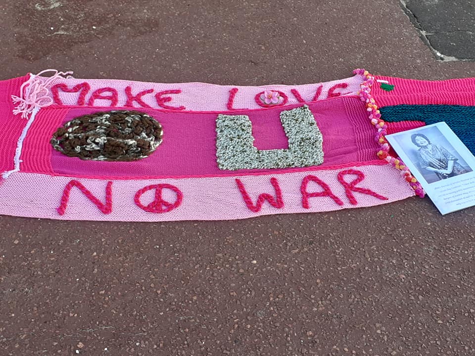 Knitted banner reading Make Love not War